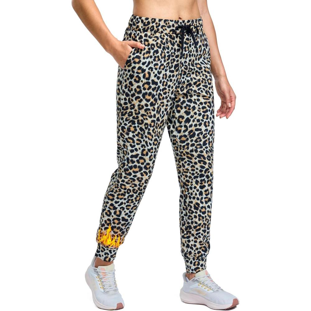 imageSANTINY Womens Fleece Lined Joggers Pockets Drawstring Waterproof Sweatpants Thermal Ski Running Winter Hiking Pants WomenLeopard