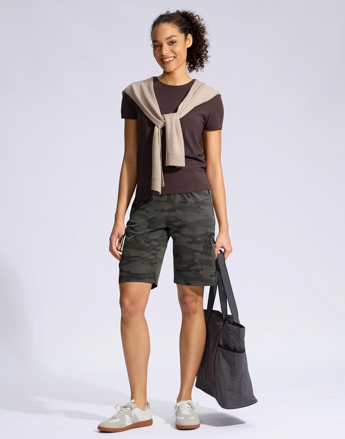 imageSANTINY Womens 10 Lightweight Hiking Cargo Shorts with 5 Zipper Pockets Quick Dry Summer Long Travel Golf Shorts for WomenGreen Camo