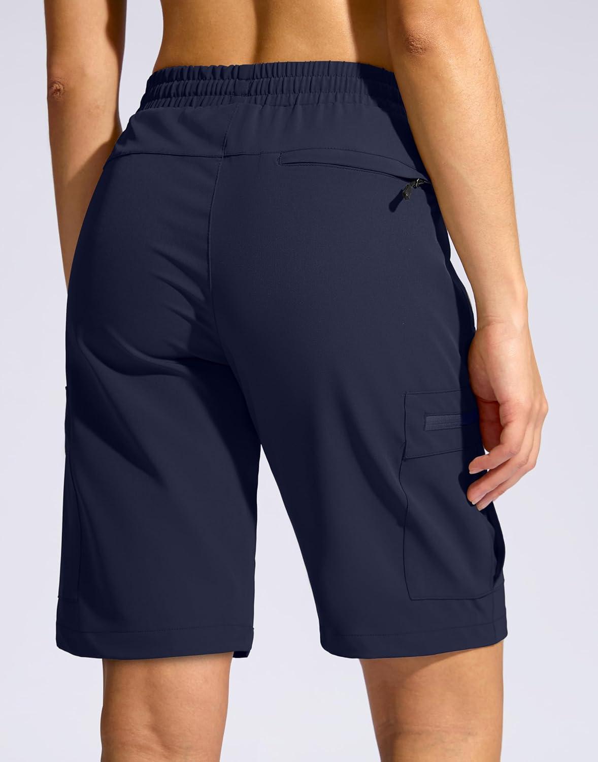 imageSANTINY Womens 10 Lightweight Hiking Cargo Shorts with 5 Zipper Pockets Quick Dry Summer Long Travel Golf Shorts for WomenNavy