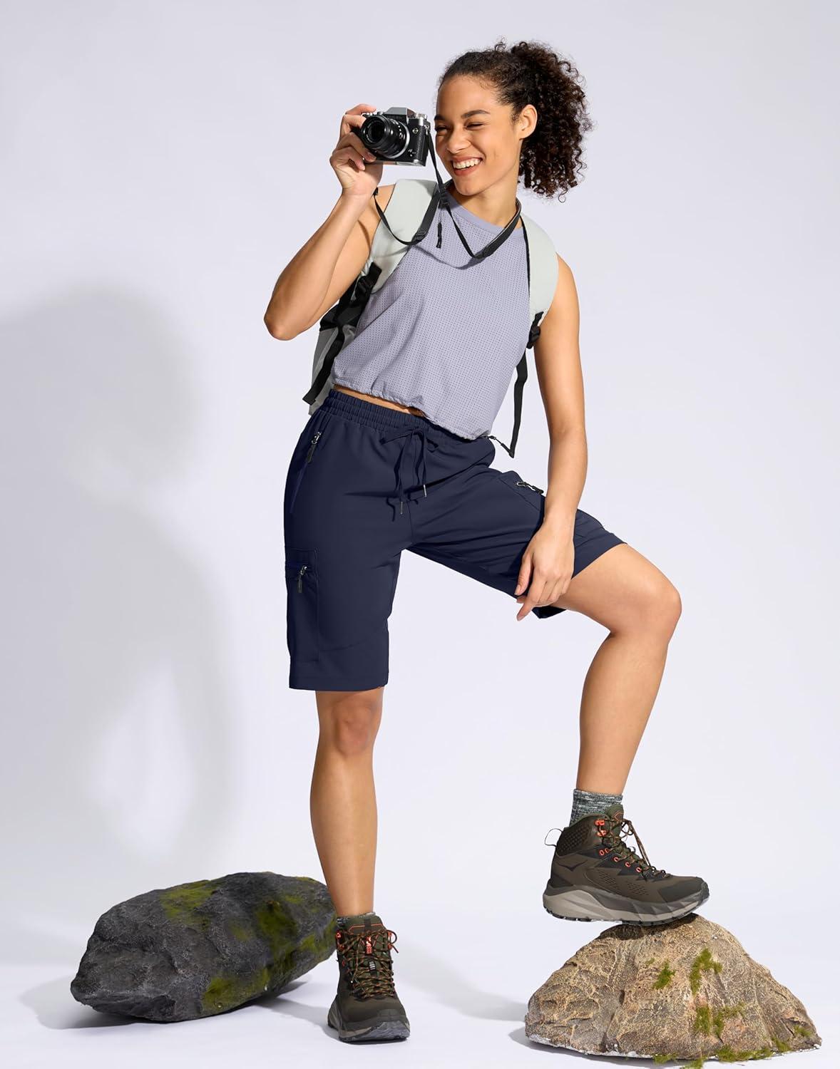 imageSANTINY Womens 10 Lightweight Hiking Cargo Shorts with 5 Zipper Pockets Quick Dry Summer Long Travel Golf Shorts for WomenNavy