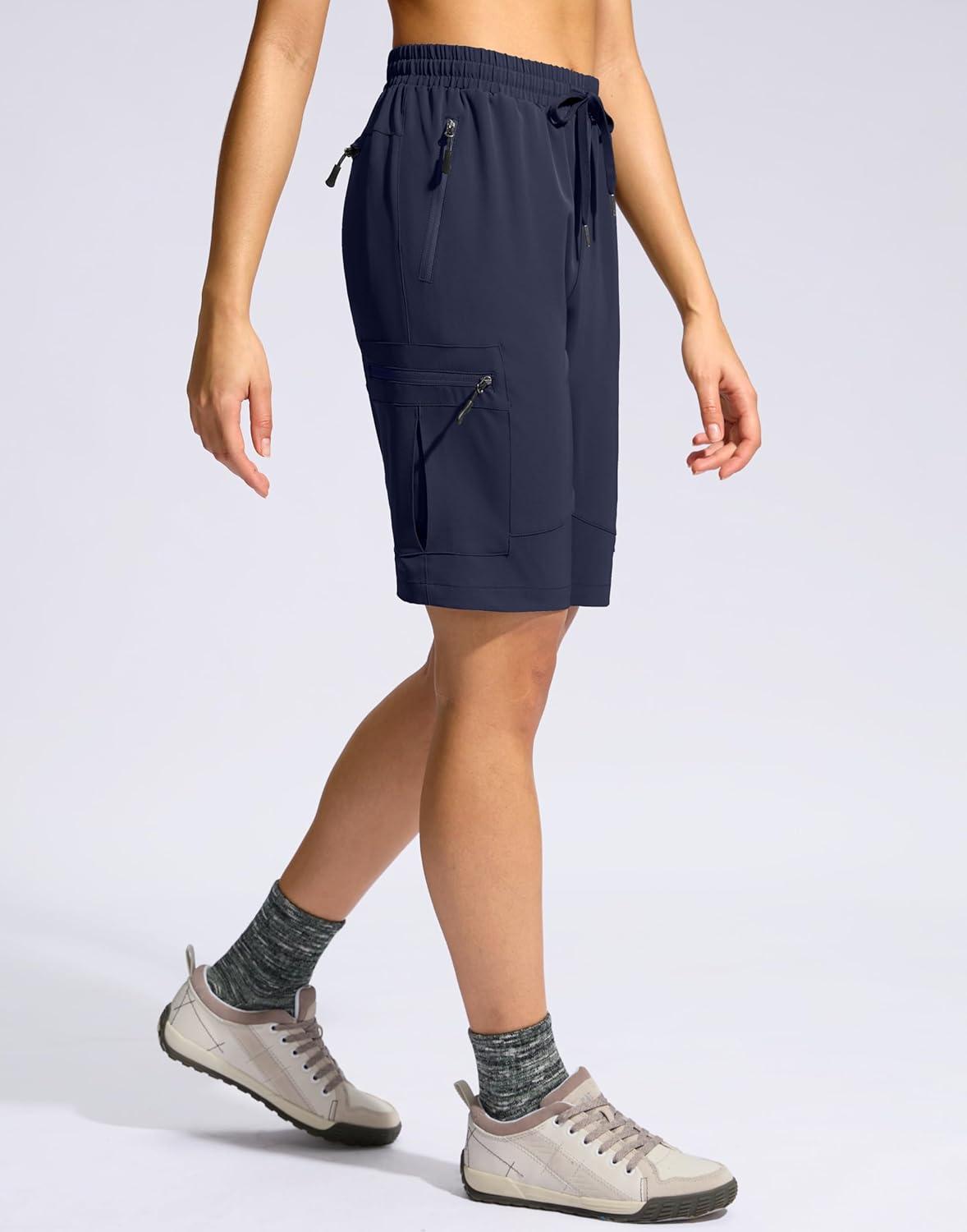 imageSANTINY Womens 10 Lightweight Hiking Cargo Shorts with 5 Zipper Pockets Quick Dry Summer Long Travel Golf Shorts for WomenNavy