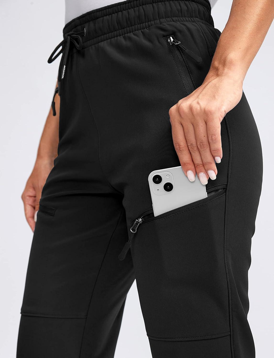 imageSANTINY Womens Fleece Lined Hiking Pants 4 Zipper Pockets Warm Winter Softshell Snow Ski Pants Waterproof Insulated