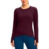 imageSANTINY Womens Long Sleeve Workout Tops Athletic Compression Shirts Cross Hem Running Gym Yoga Shirt with Thumb HoleWine