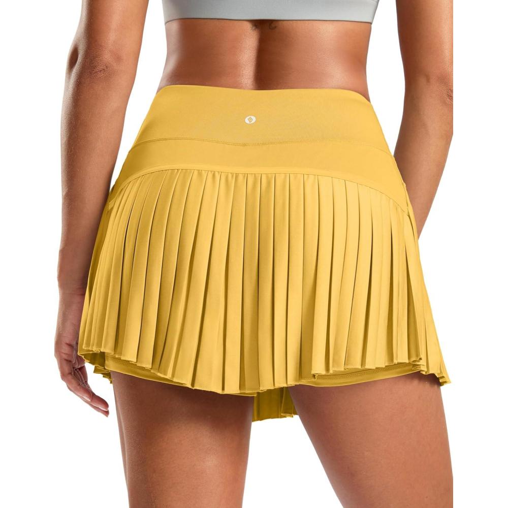 imageSANTINY Pleated Tennis Skirt for Women with Pockets High Waisted Athletic Golf Skorts with Shorts for Workout PickleballYellow